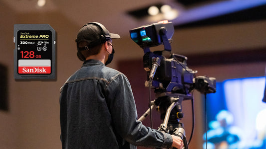 Videographer filming with professional camera, featuring SanDisk Extreme PRO SDXC UHS-II card — built for 8K video and high-speed photography.