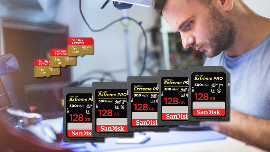 Stack of SanDisk SD and microSD cards with packaging on a desk — wholesale memory card bulk deals in Canada.