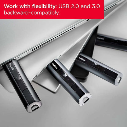 SanDisk Extreme PRO USB flash drive plugged into laptop.
